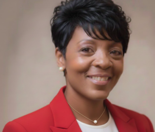 Group of young students reviewing documents outside a university building.